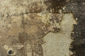 Old peeling paint on walls, painted walls damaged from dampness and aging, textured old wall background