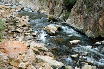 water flows over the rocks in a river in the mountains, the waitawheta river