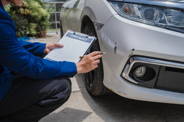 businessman in suit and car auto insurance agent assess car damage, discussing deductible, claims,...