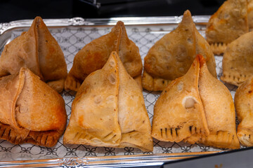 Traditional Middle East snack fried stuffed samosa pies with vegetables