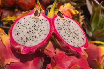Red ripe dragon fruit pitaya, tasty tropical exotic fruits close up