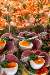 Fancy appetisers made with deafood, tuna fish, eggs, anchovies, shrimps