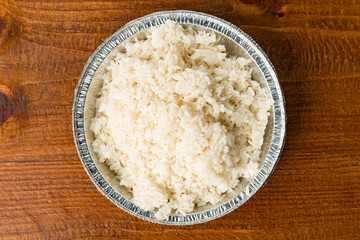 White rice in a takeout container