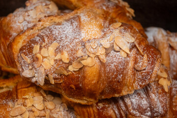 Fresh baked pastries for breakfast, almond croissant with almond cream filling