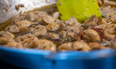 Vegetarian street food in Germany, roasted champignons mushrooms with sour cream