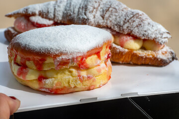 Dutch cuisine, fresh baked strawberry cake and croissant with cream and fresh fruits