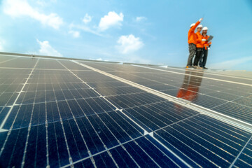 engineer man inspects construction of solar cell panel or photovoltaic cell by electronic device. Industrial Renewable energy of green power. factory worker working on tower roof.