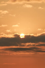 Close up view of sun hidden behind clouds photography