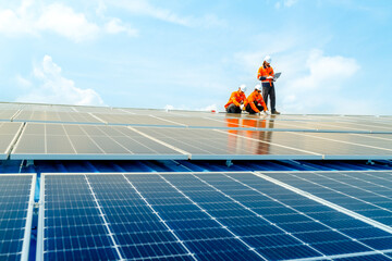 engineer man inspects construction of solar cell panel or photovoltaic cell by electronic device....