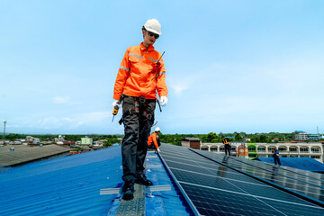 engineer man inspects construction of solar cell panel or photovoltaic cell by electronic device....