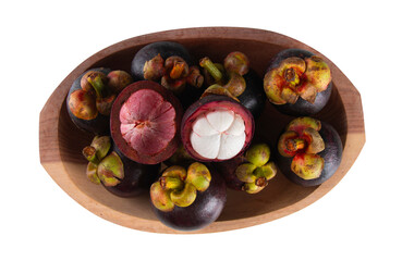 Fresh mangosteen fruit in wooden bowl top view