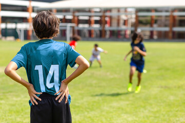 Children Enjoying a Friendly Soccer Game Outdoors