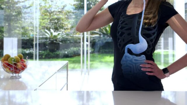 Athletic Woman Drinks Detox Beverage that Helps Eliminate Toxins from inside of her Digestive System. Female taking pill for stomach disease. Gut cleaning.