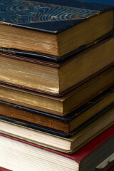 Stack of vintage books. Colorful bindings on a pile of texts. 