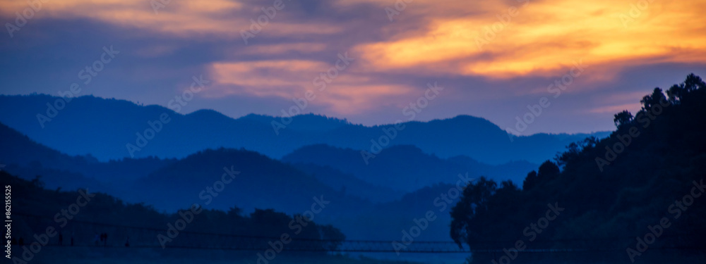 Wall mural Banner purple sky sunrise dramatic beautiful landscape view. Dawn sky violet pink gold dusk time cloudscape with sunlight. Panorama Dramatic vibrant sunset scenic landscape nature with copy space