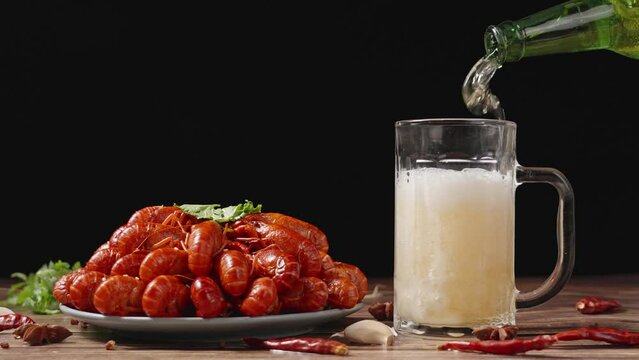  boiled Asian Food Spicy crawfish and beer on wooden table.