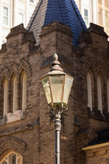 Sunset view of a historic street lamp and downtown buildings of Jackson, Mississippi, USA.