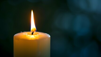 White candle burning on a dark background, a close-up of the flame and soft lighting, remembrance or contemplation. The candle is centered in front with its light casting gentle shadows around it.