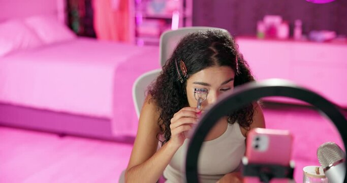 Woman, content creator and ring light for recording, cosmetics influencer and live streaming in home. Talking, beauty or tutorial for eyelash curler on social media, vlogger person or online webcam