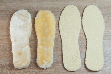 Warm and cozy shoe insoles crafted from natural white sheepskin for ultimate comfort in cold weather