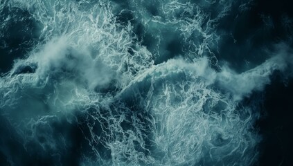 A top-down view of the ocean showcases tumultuous stormy waves with foamy white crests and swirling dark depths, highlighting the power and drama of nature.