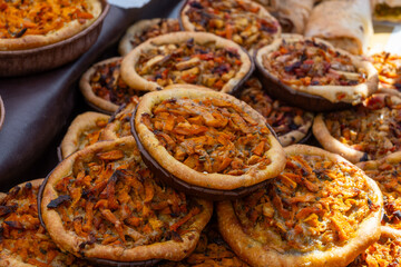 Tasty vegetarian food, french quiche savoury tart with pumpkin, onion and cheddar cheese and mushrooms