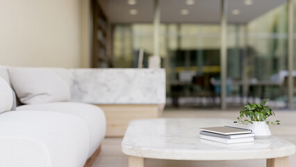 A white marble coffee table in a modern office lounge or waiting room.