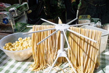 Italian food, fresh homemade pasta tagliatelle ready to cook on Portobello road food market, London © barmalini