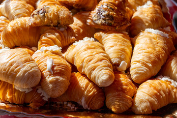 Naples sfogliatella, shell-shaped layered pastry, with sweet custard-like filling made with semolina, ricotta, and candied citrus fruit.
