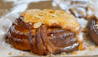 Almond scones - traditional British baked good, popular in the United Kingdom and Ireland, tea buns make with yeast with different toppings