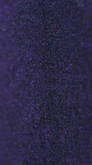 Liquid shimmer texture. Glitter paint flow. Blur purple black color sparkling metallic sequin sand particles ink fluid wave abstract art background with bokeh lights.