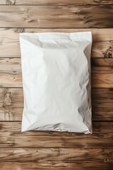 Obraz premium white packaging bag mockup, on a wooden table, top view with header seal, for coffee, tea, 2:3