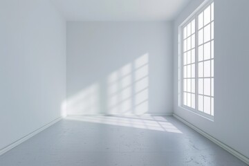 Fototapeta premium Empty white room with natural light streaming through large windows, creating a serene atmosphere with strong shadows on the floor.
