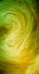 Smoke vortex. Ink cloud. Blur neon yellow green color glowing haze cloud texture paint floating in water dreamlike abstract art background.