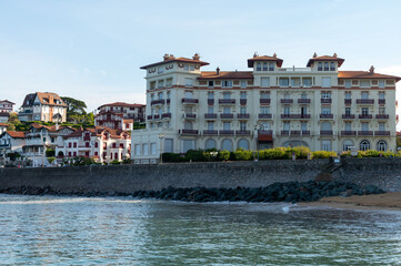Obraz premium White houses and villas of Saint Jean de Luz on Basque coast, famous resort, known for beautiful architecture, nature and cuisine, South of France, Basque Country