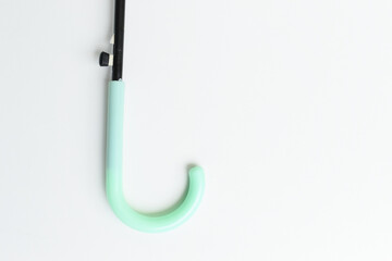 handle of green umbrella isolated on white background