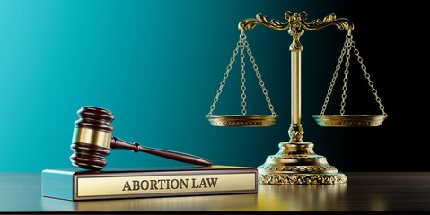 Abortion law: Judge's Gavel as a symbol of legal system, Scales of justice and wooden stand with...
