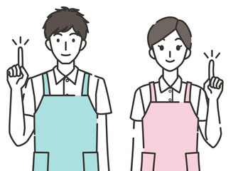 指差しポーズの介護士の男性と女性