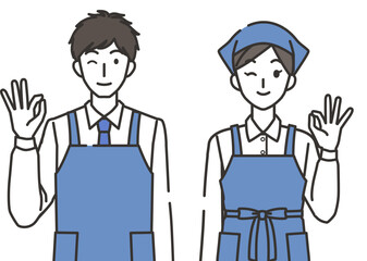 オッケーポーズの店員の男性と女性