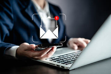 Businesswomen using smartphones check New email notifications and business digital online marketing. Inbox receiving electronic message alert. icon envelope virtual screen, communication technology.
