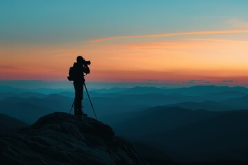 Silhouette of a photographer who shooting a sunset on the mountain