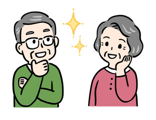 ほほえみながら喜ぶシニア夫婦