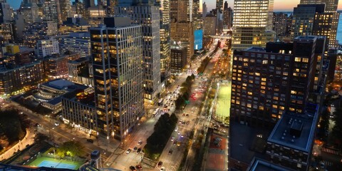 Night New York City, Manhattan famous top view. Night Manhattan from above. Manhattan panorama at sunset. NYC skyline at twilight. New York famous building. Night traffic in NYC. Lower Manhattan.
