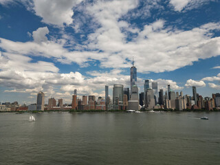Obraz premium New York City. NYC aerial view, New York City Skyline with dramatic sky. Panoramic drone view on Manhattan in NY. Sunset in NYC. New York City Midtown skyline view at dusk with dark clouds.