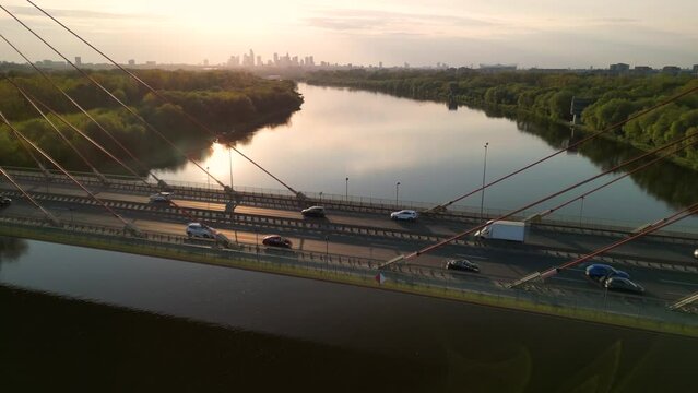 Warszawa City panorama with siekierkowski bridge and cyclist riding through int. the morning sunbath