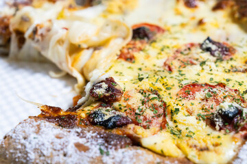 slice of pizza with cheese and vegetables