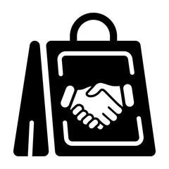 Shopping bag with handshake is denoting customer cooperation, solid icon 