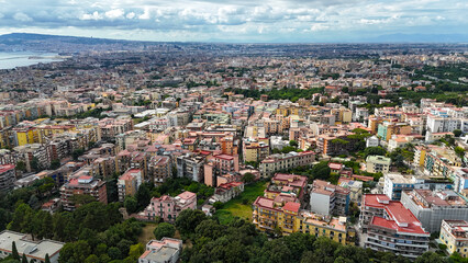 Aerial view of the metropolitan city of Naples. In the foreground the cities of Portici and San Giorgio a Cremano