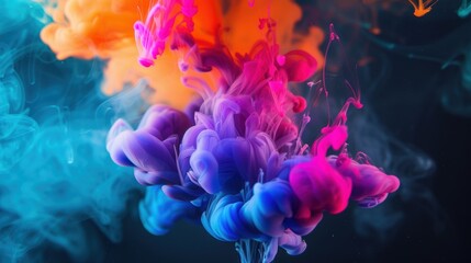 Fototapeta premium Vibrant and colorful ink swirls merging in water, creating a mesmerizing and dynamic abstract visual effect.
