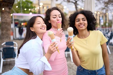 Young women eating ice cream on a sunny day